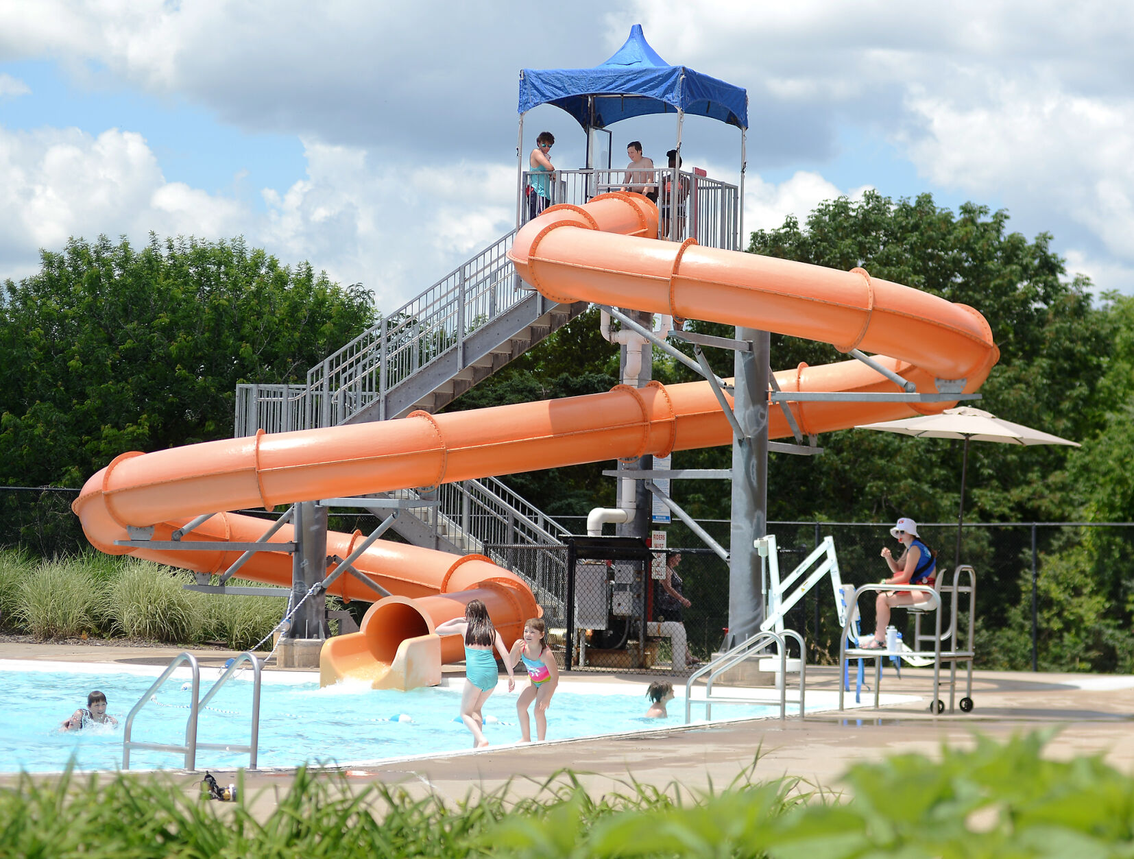 People wait to go down the slide